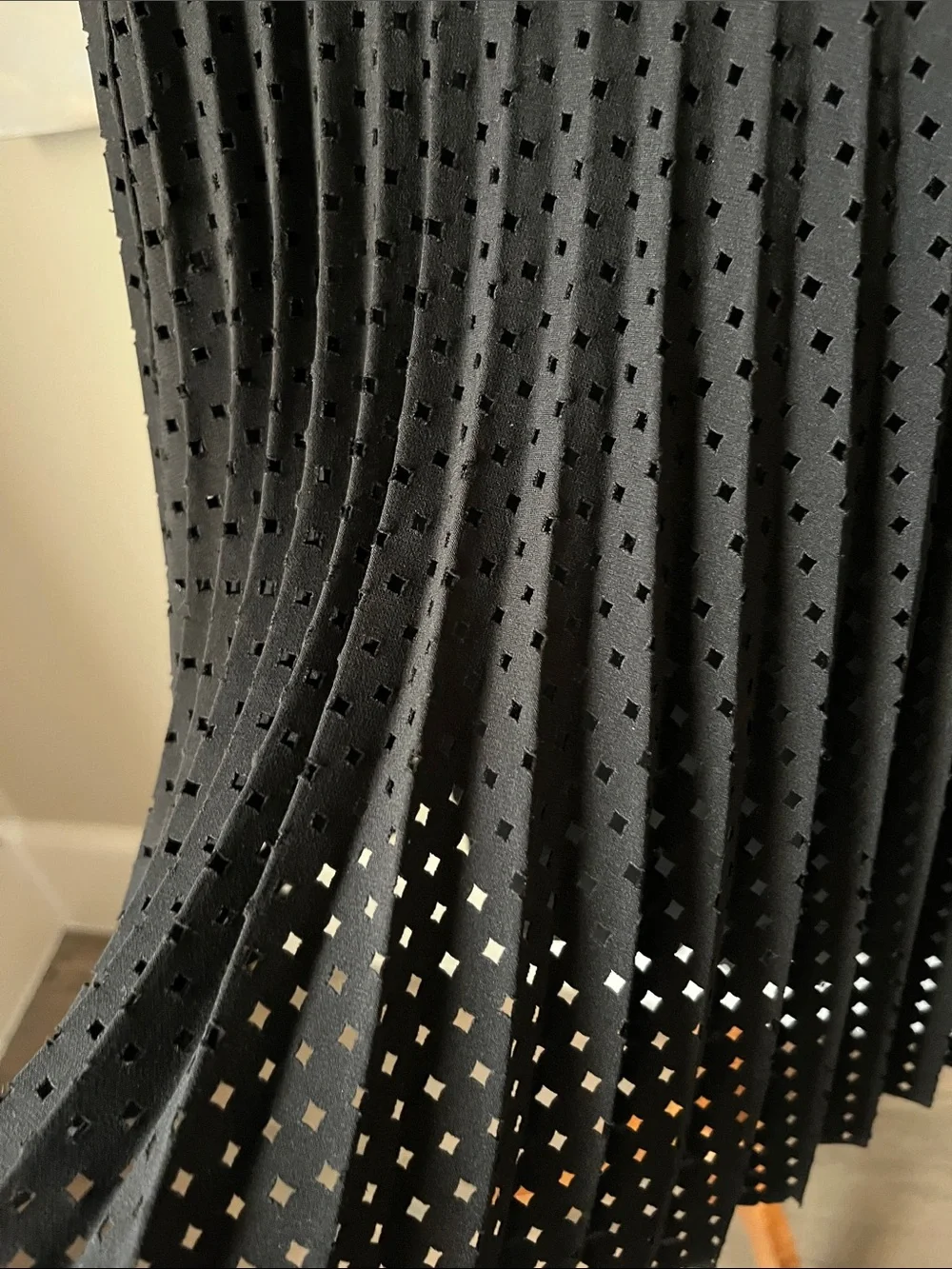 J. Crew black laser cut pleated A-line skirt.